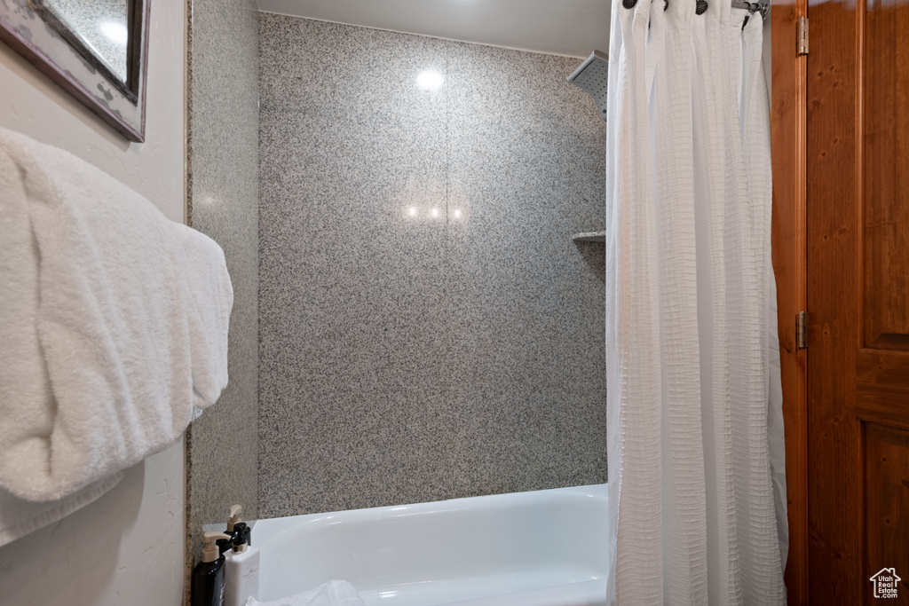 Bathroom featuring shower / bath combo with shower curtain