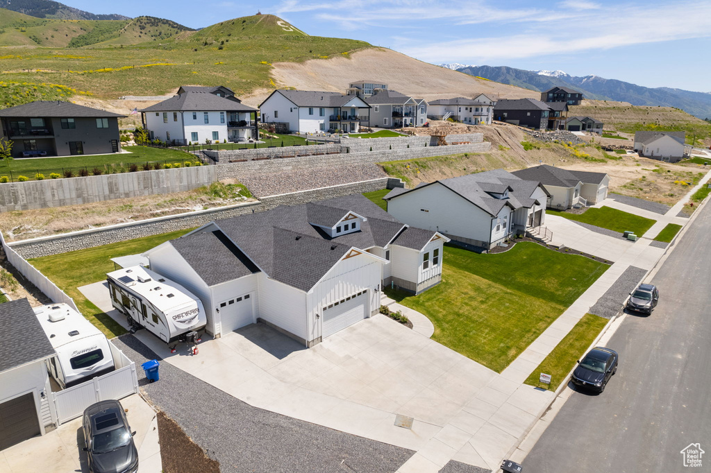 Aerial view of residential area featuring a mountainous background