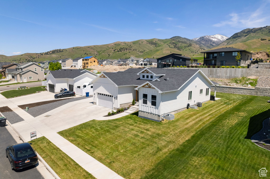 Aerial perspective of suburban area featuring a mountain backdrop