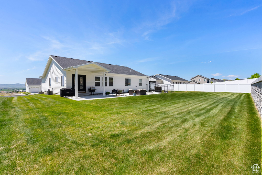 Back of property with a patio area