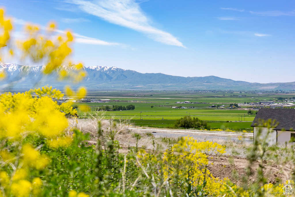View of mountain backdrop with rural landscape