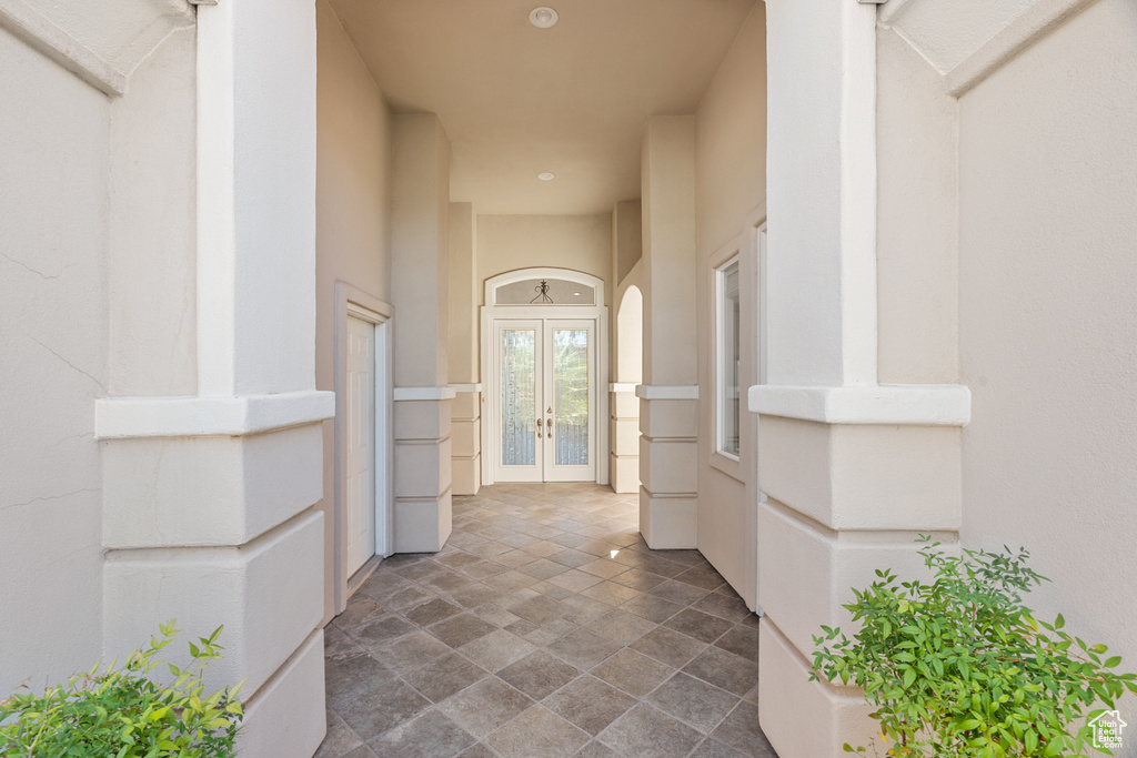 View of exterior entry featuring french doors