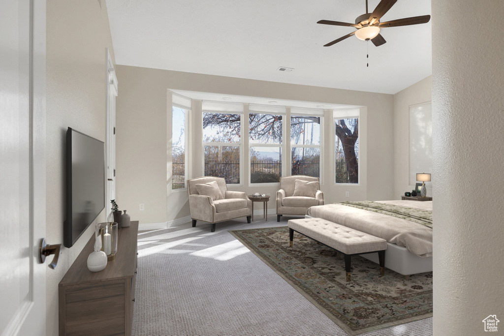 Bedroom with baseboards, visible vents, lofted ceiling, ceiling fan, and carpet floors