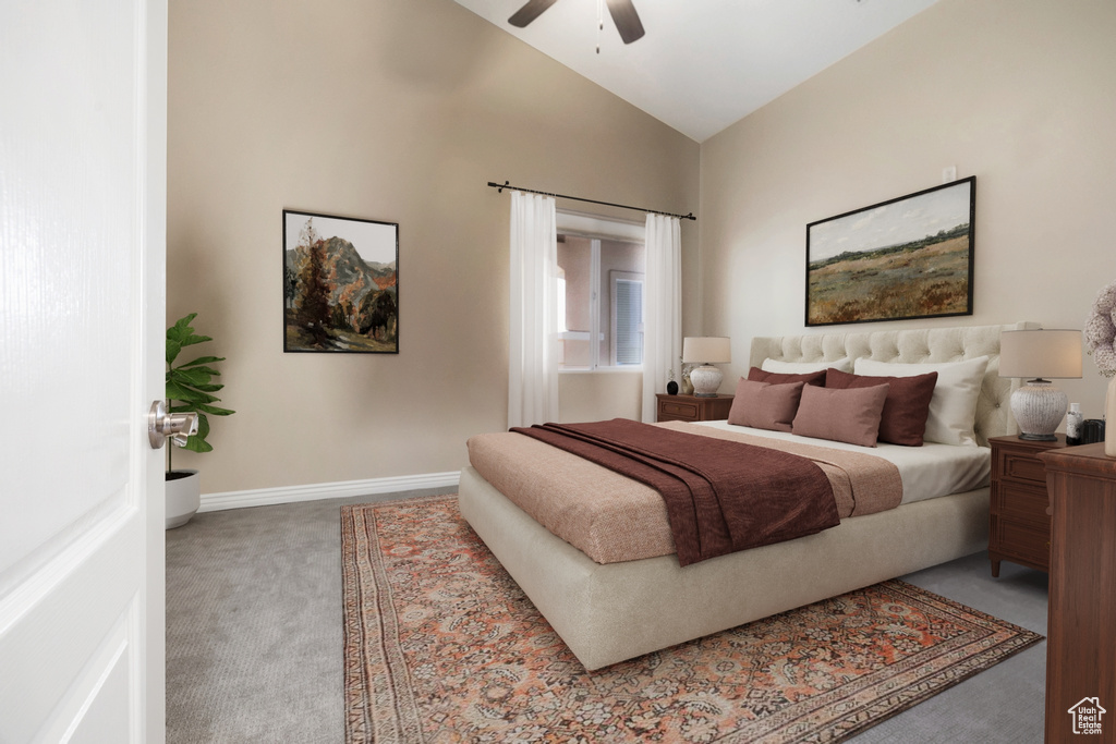 Bedroom with a ceiling fan, carpet, lofted ceiling, and baseboards
