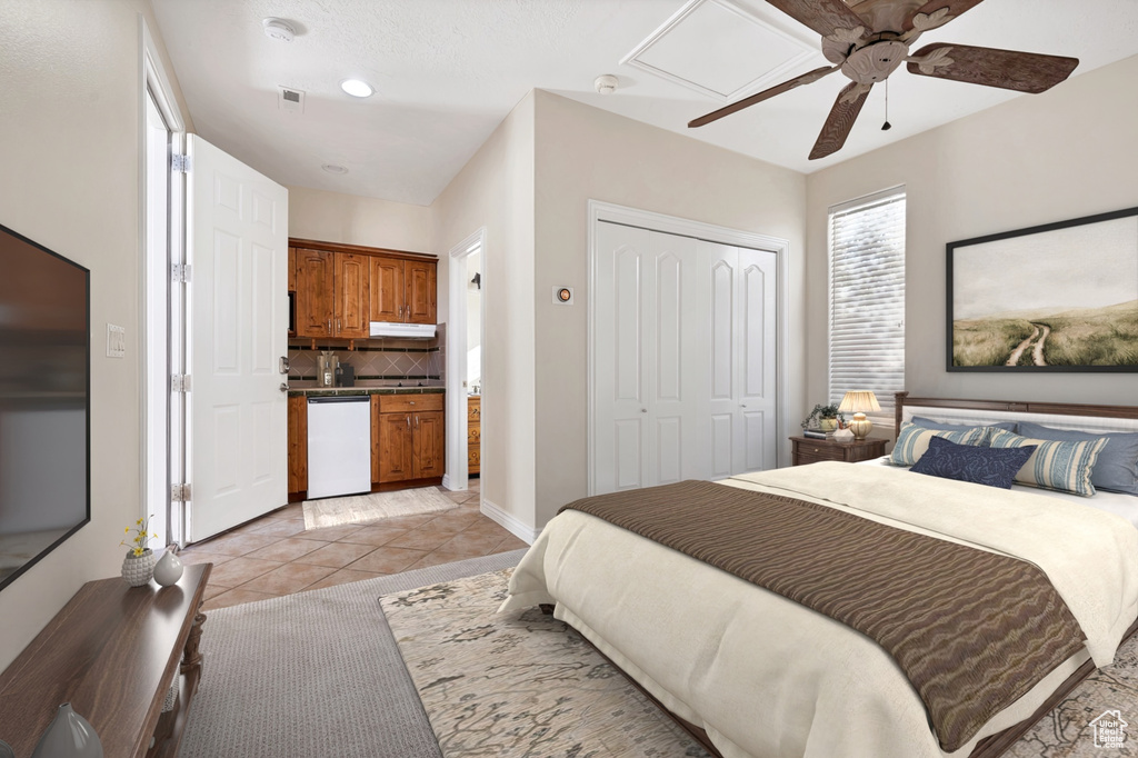 Bedroom featuring light tile patterned floors, visible vents, a ceiling fan, baseboards, and a closet