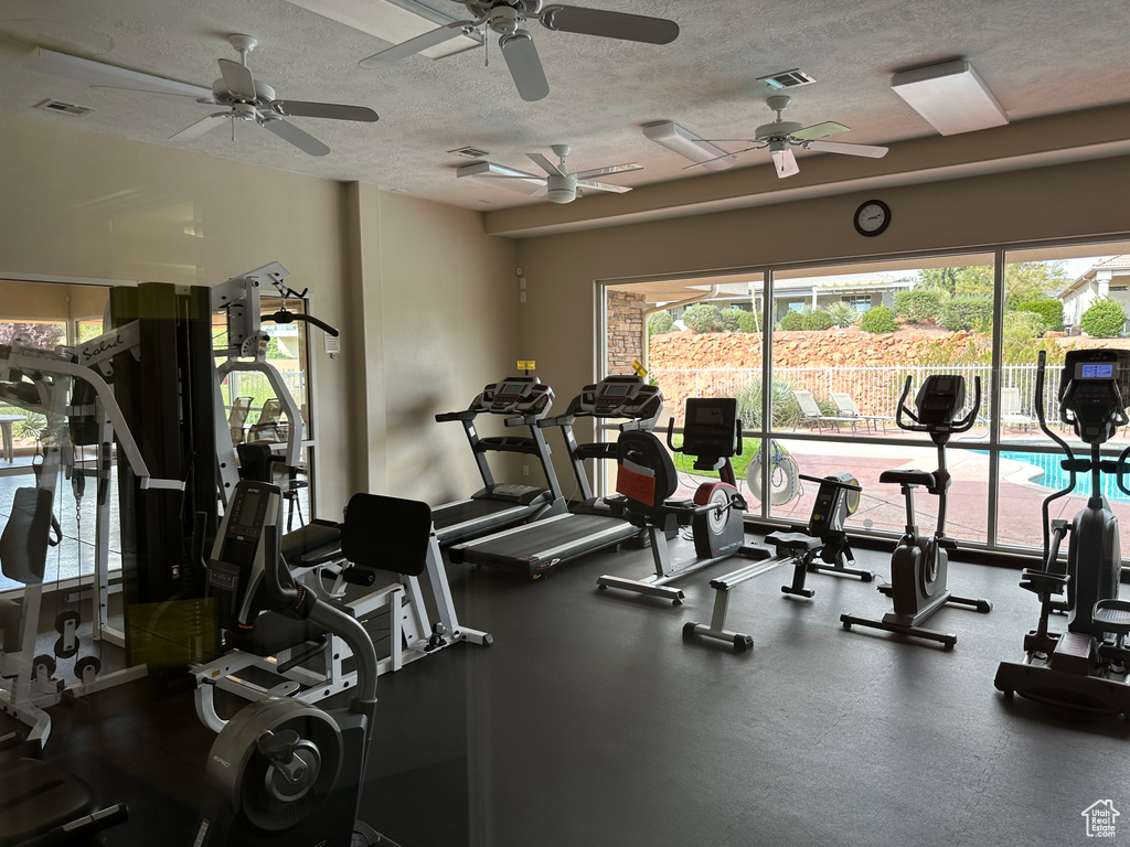 Exercise room featuring visible vents and a textured ceiling