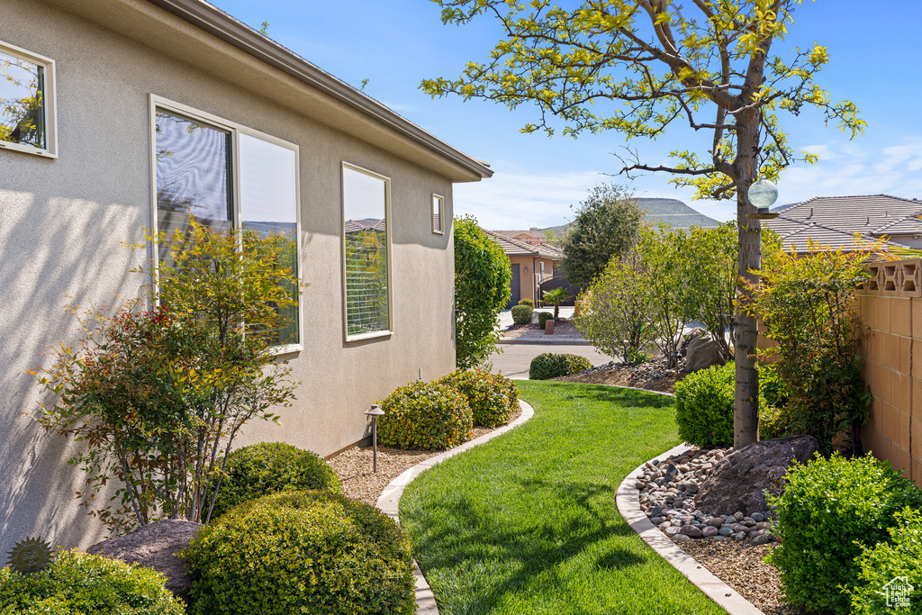 View of yard featuring fence