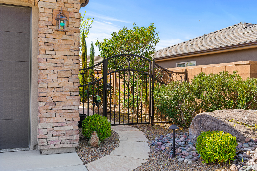 View of gate featuring fence