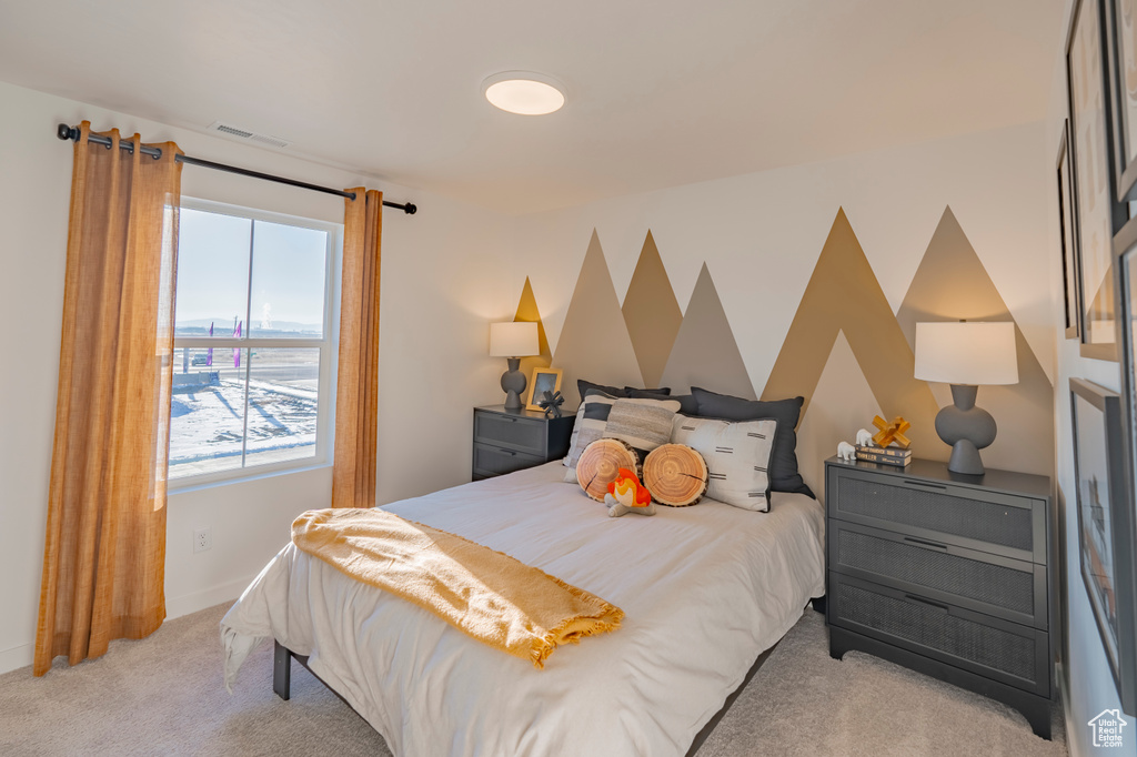 Bedroom featuring carpet, visible vents, and baseboards