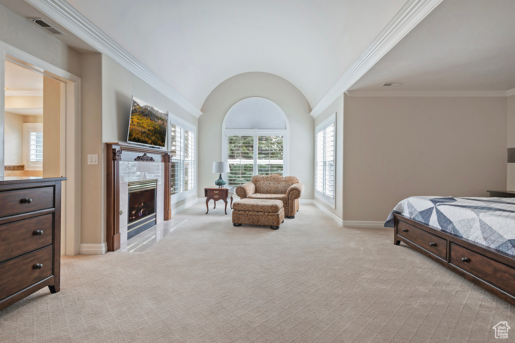 Bedroom featuring visible vents, baseboards, a tiled fireplace, and light colored carpet