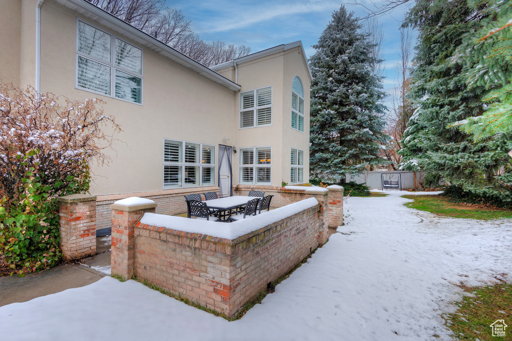 Back of house featuring a patio area and stucco siding