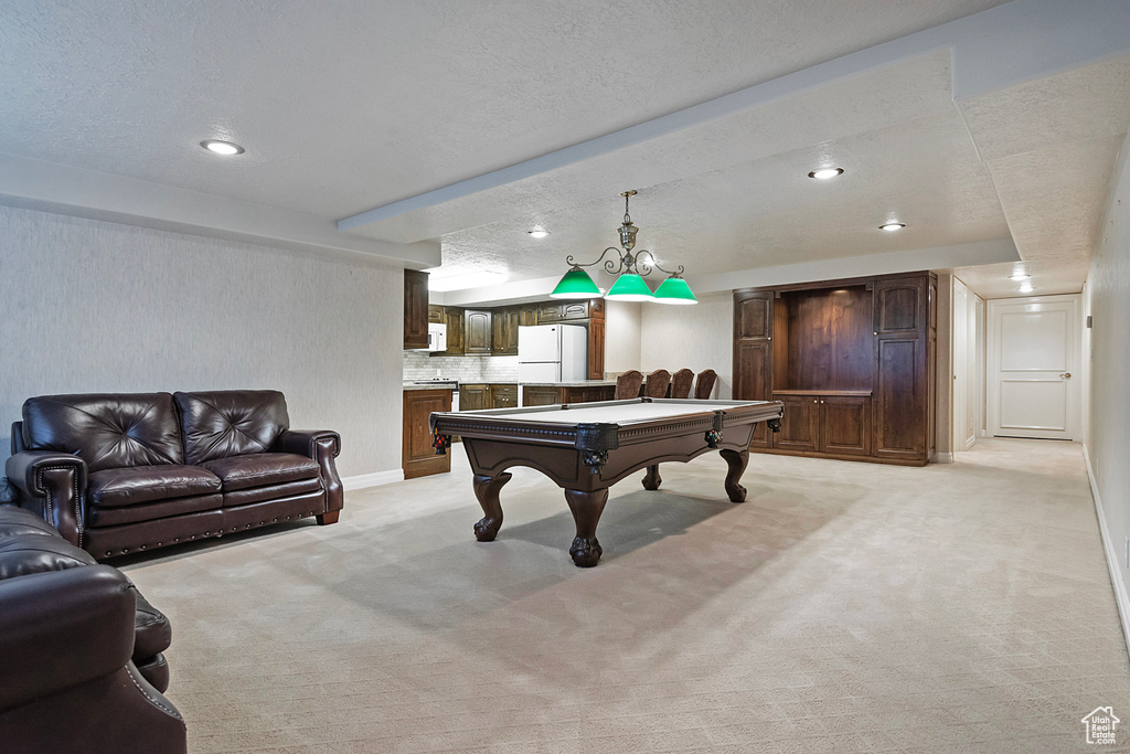 Playroom with recessed lighting, light colored carpet, billiards, and a textured ceiling