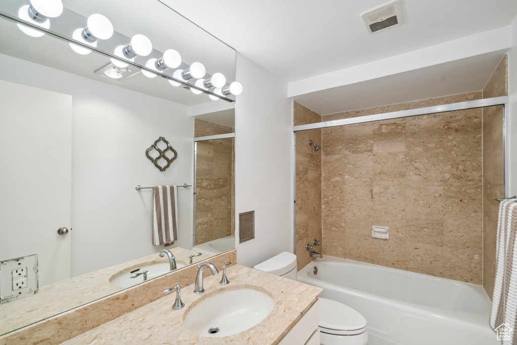Bathroom featuring vanity and tub / shower combination