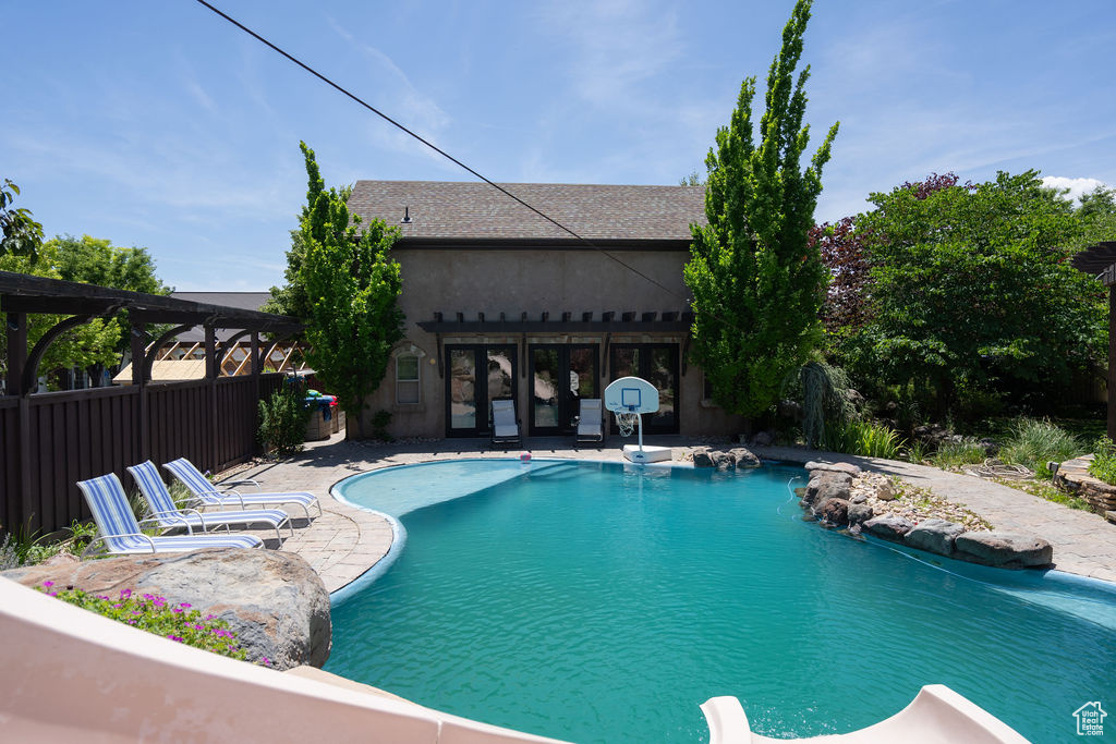 Swimming pool featuring a patio and a pergola