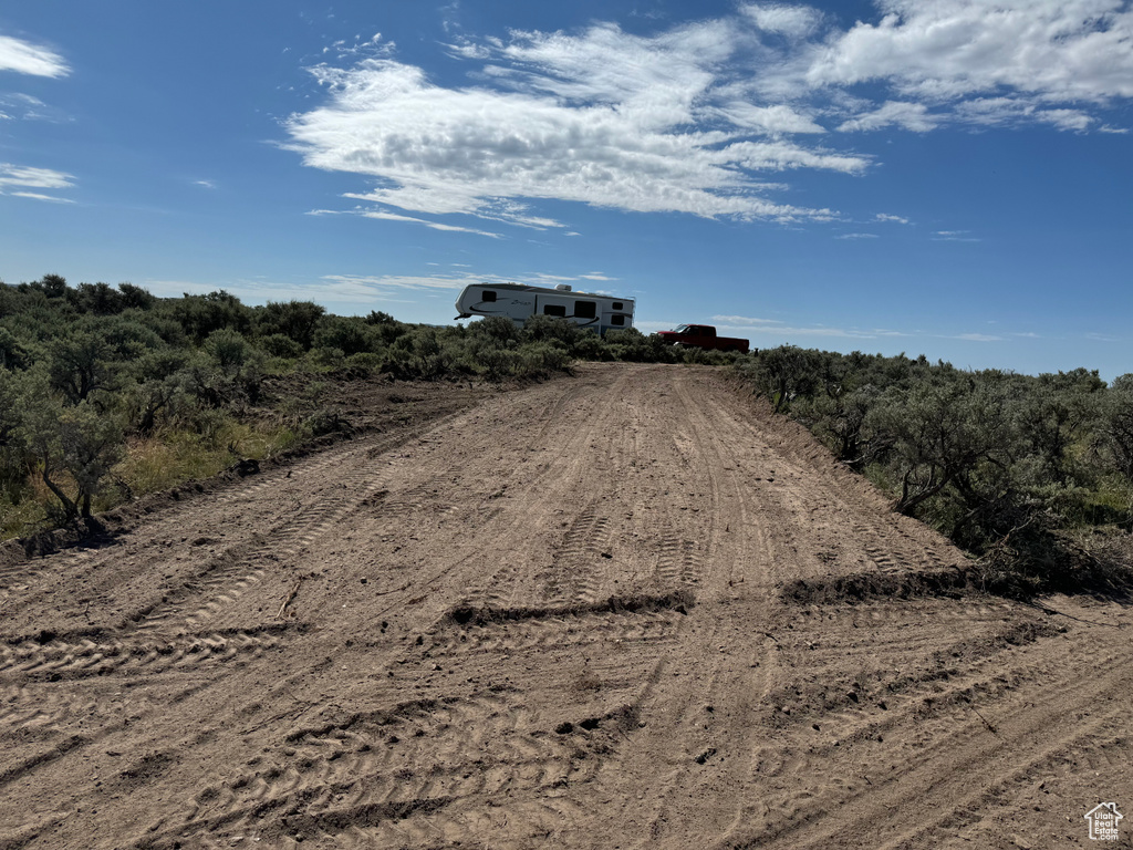 View of street featuring dirt driveway