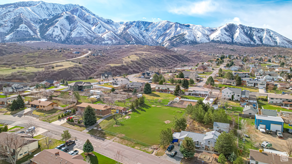 Birds eye view of property featuring a mountain view and a residential view