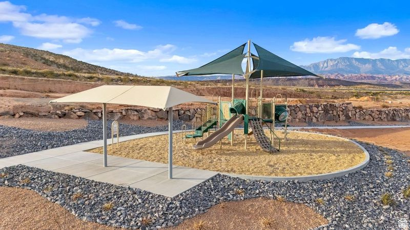 Communal playground featuring a mountain view