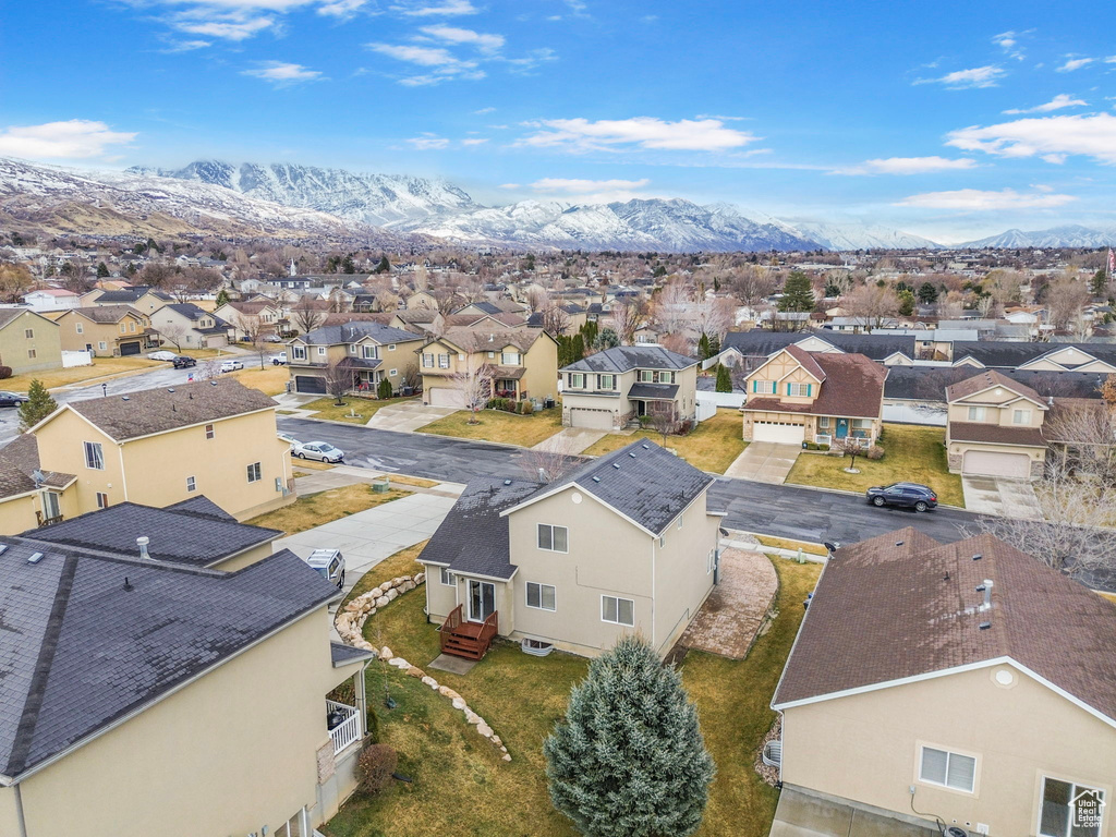 Drone / aerial view with a residential view and a mountain view