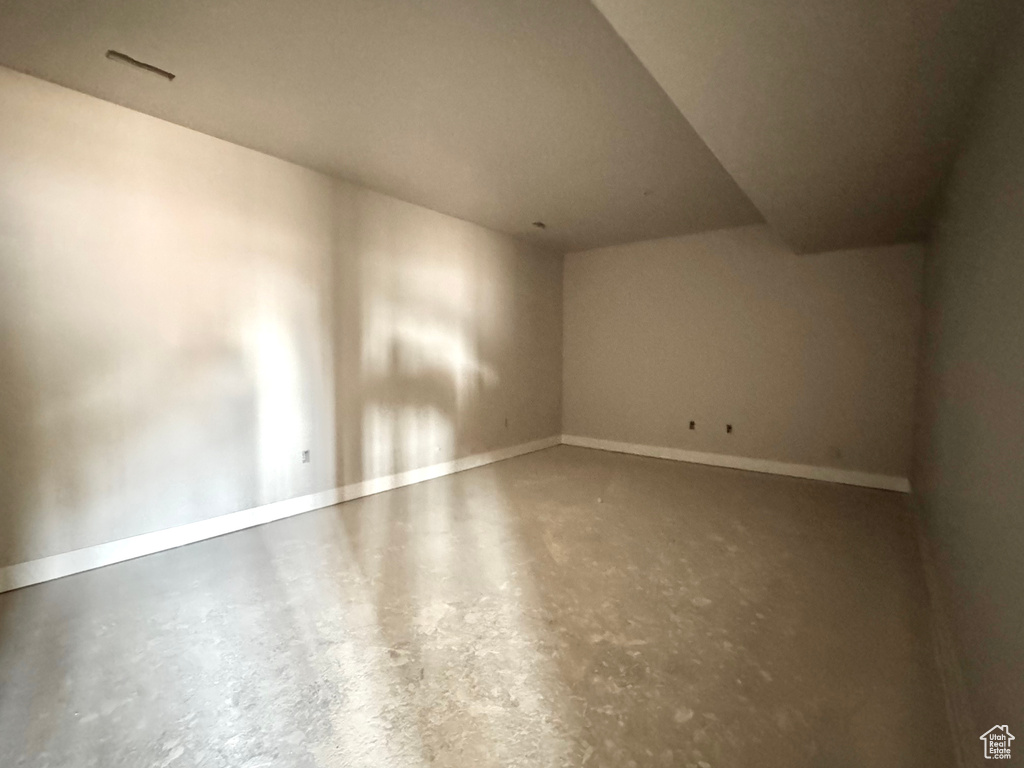 Interior space featuring concrete floors and baseboards