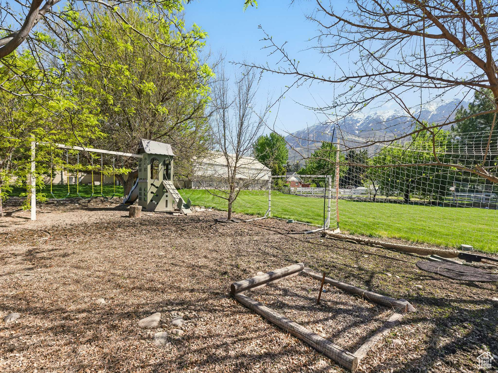 View of grassy yard with a playground