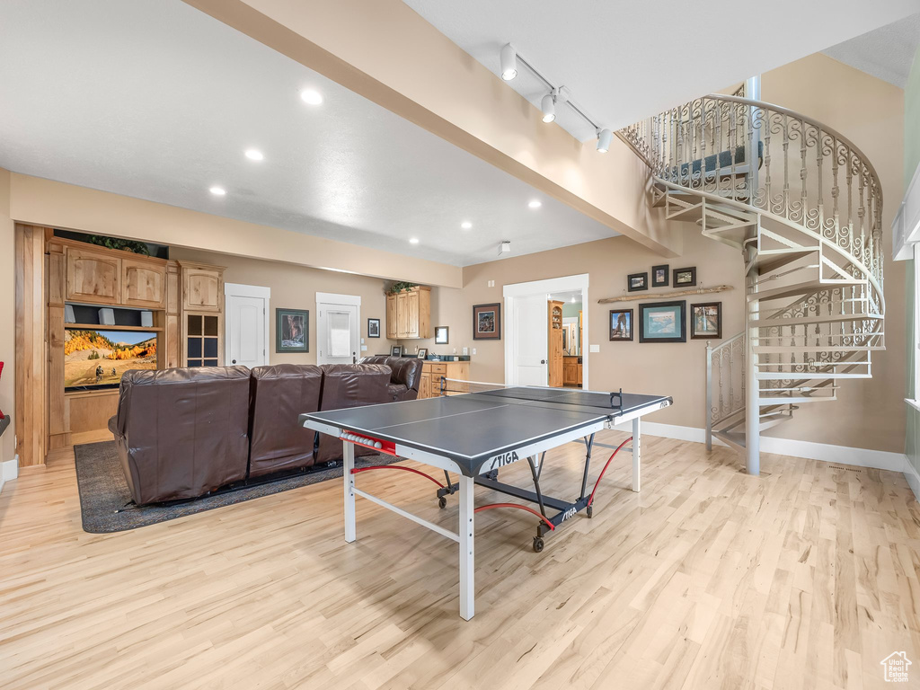 Playroom with light wood-type flooring, baseboards, and recessed lighting