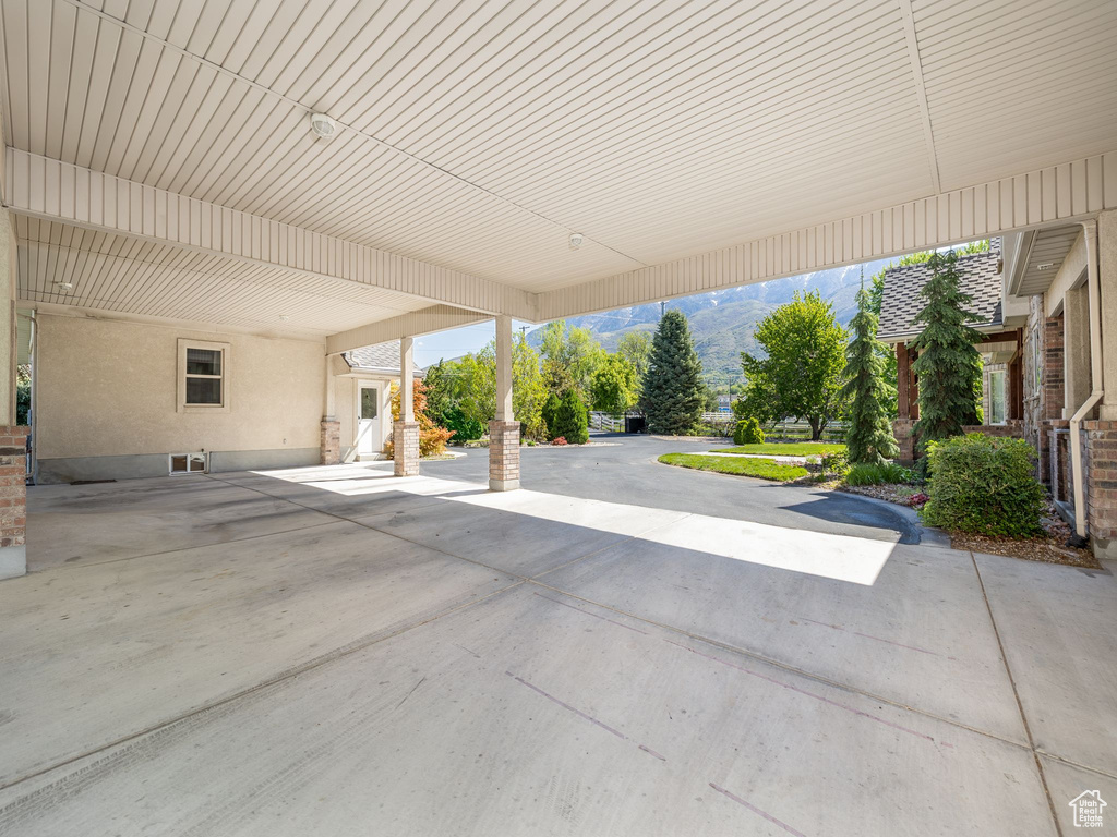 View of patio with a carport and a mountain view