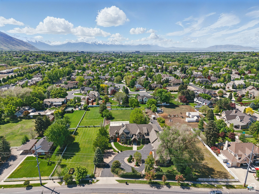 Aerial view of residential area with a mountainous background