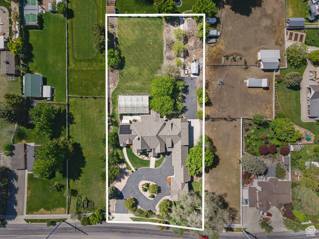 Aerial perspective of suburban area featuring property boundaries highlighted
