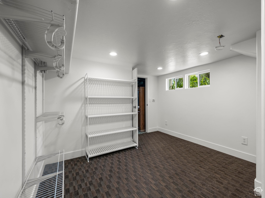 Basement with recessed lighting, baseboards, and carpet