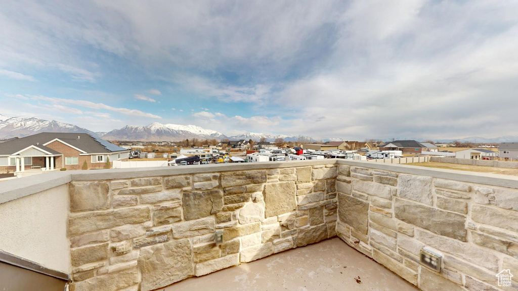 View of patio with a residential view and a mountain view