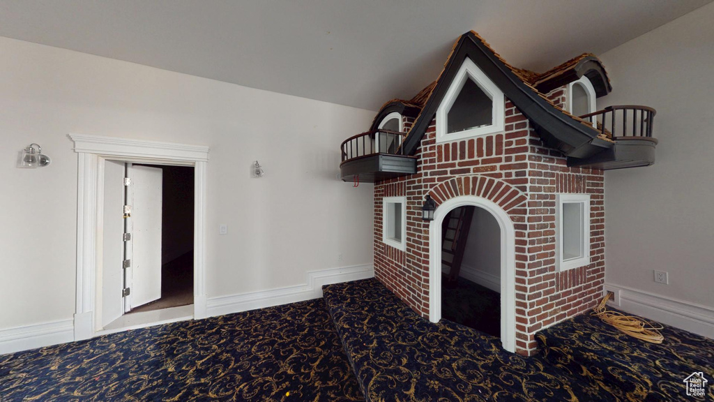 Interior space with carpet and baseboards
