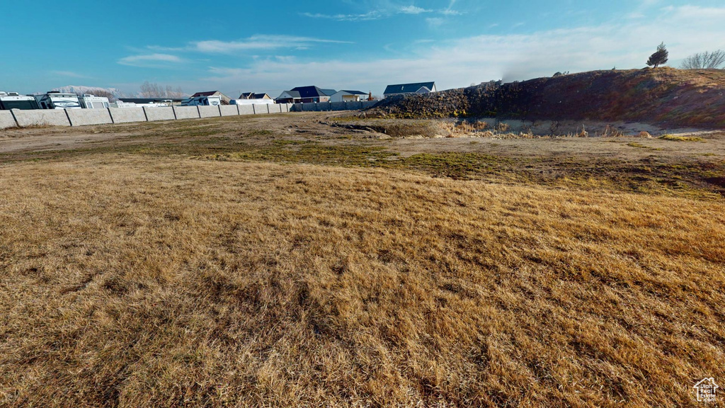 View of yard featuring fence