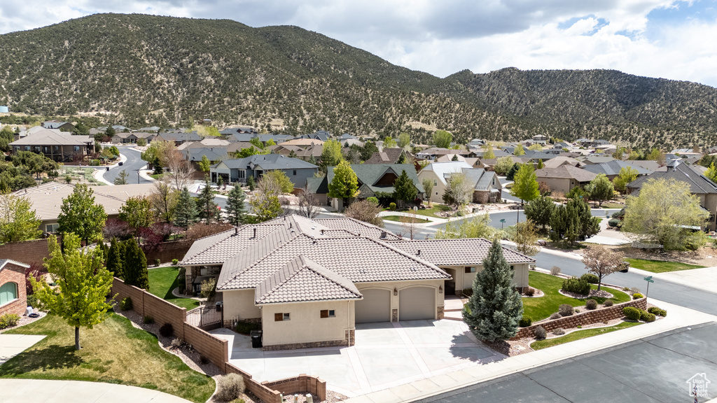 Drone / aerial view featuring a mountain view and a residential view
