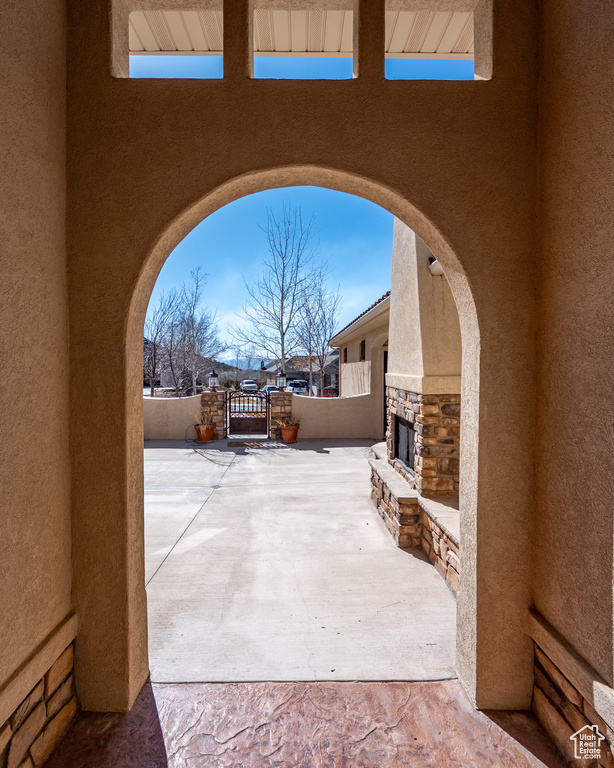 View of patio featuring a gate and fence