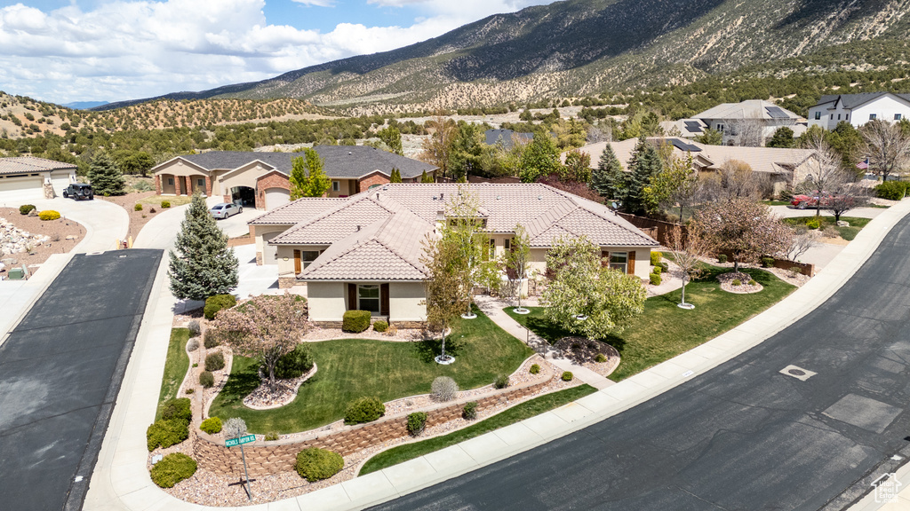 Drone / aerial view with a residential view and a mountain view