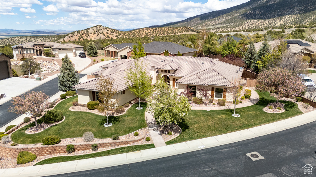 Birds eye view of property featuring a mountain view and a residential view