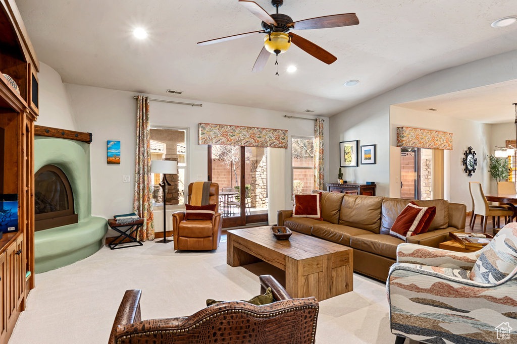 Living room with recessed lighting, a ceiling fan, visible vents, and light colored carpet