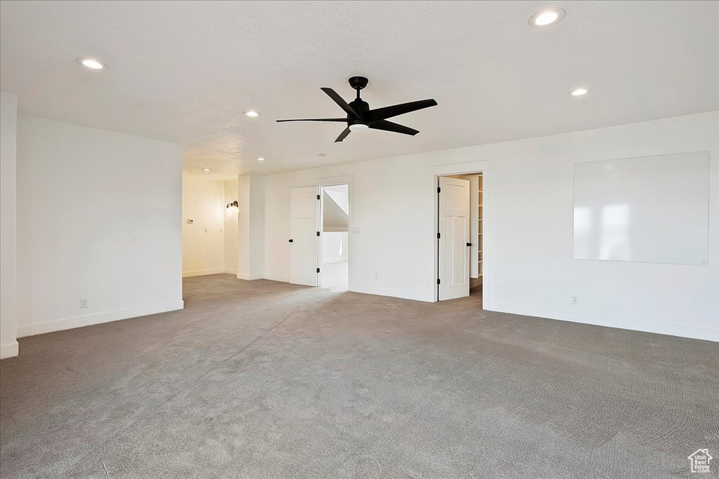 Unfurnished room with baseboards, ceiling fan, carpet flooring, and recessed lighting