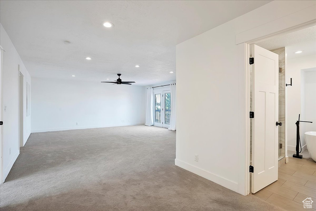 Empty room with a ceiling fan, recessed lighting, and baseboards