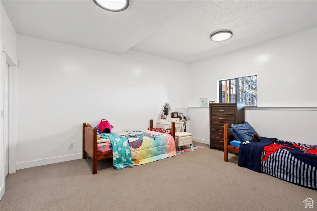 Bedroom with carpet and baseboards