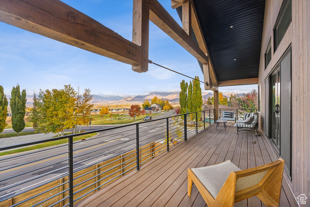 Wooden terrace featuring a mountain view