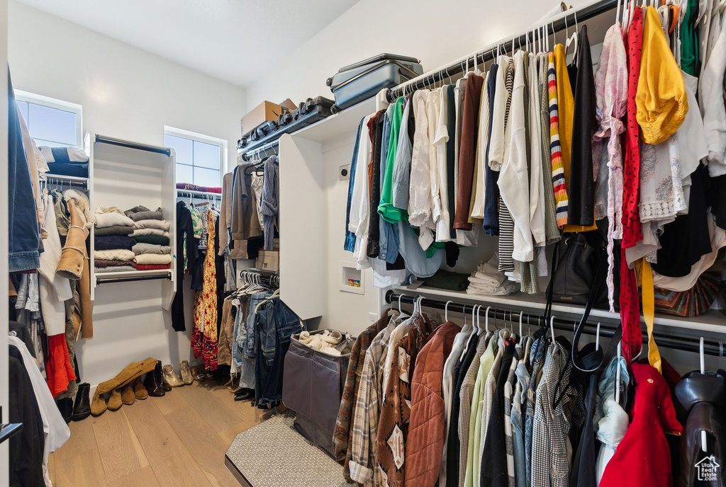 Walk in closet featuring wood finished floors