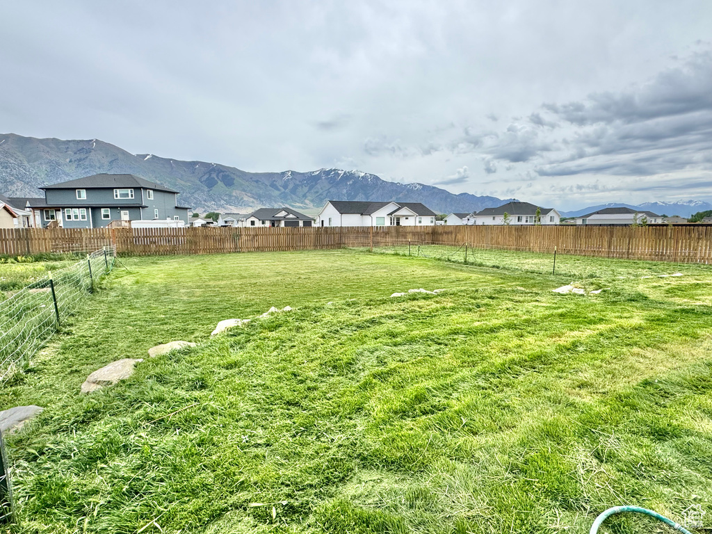 View of yard featuring a mountain view and a residential view