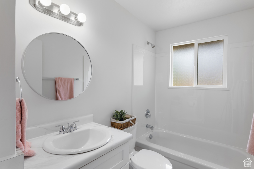 Full bath featuring shower / bathtub combination, vanity, and toilet
