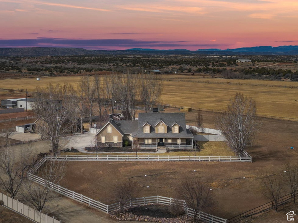 Birds eye view of property with a rural view and a mountain view