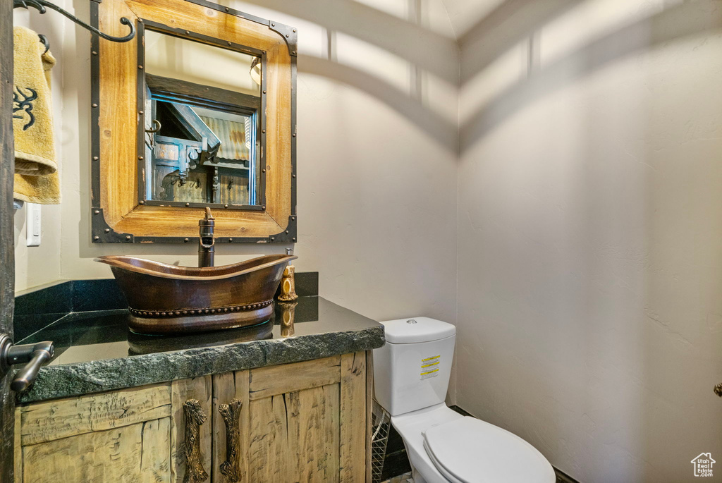 Bathroom with toilet and vanity