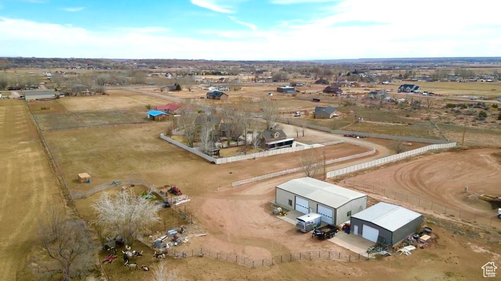 Birds eye view of property featuring a rural view