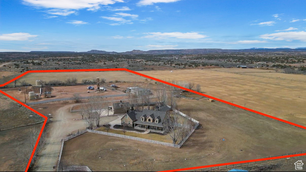 Birds eye view of property with a rural view and a mountain view