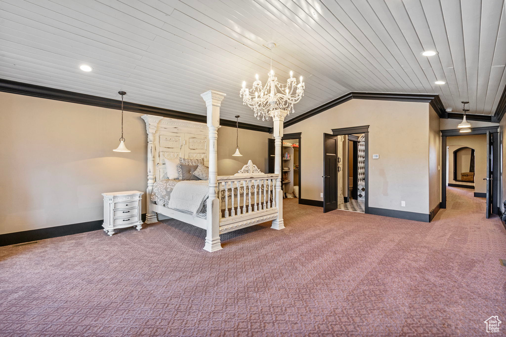 Unfurnished bedroom featuring baseboards, wooden ceiling, ornamental molding, vaulted ceiling, and carpet flooring