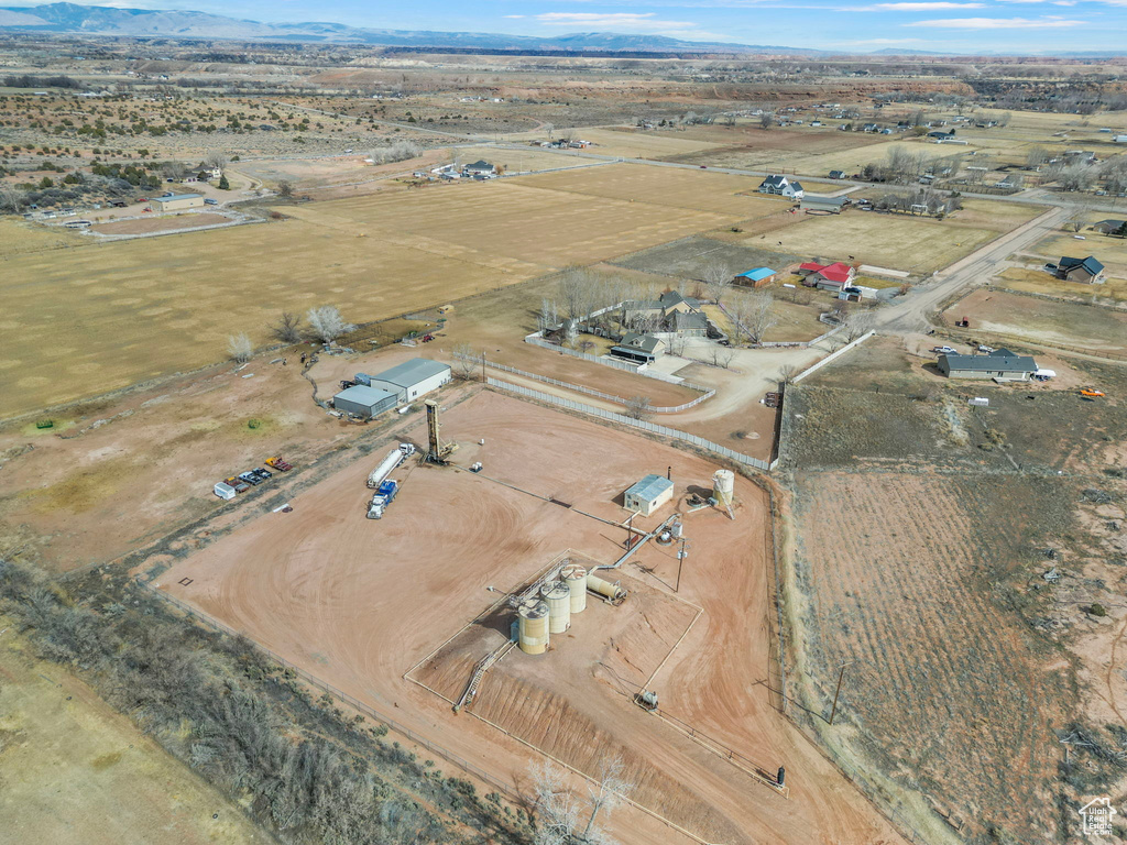 Birds eye view of property with a mountain view and a rural view